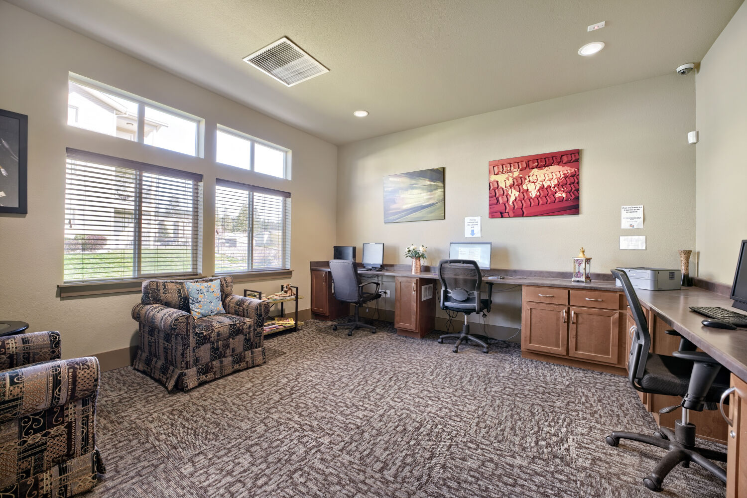 Resident business center with computers, workspace, and printing access at Copper Hill Apartments