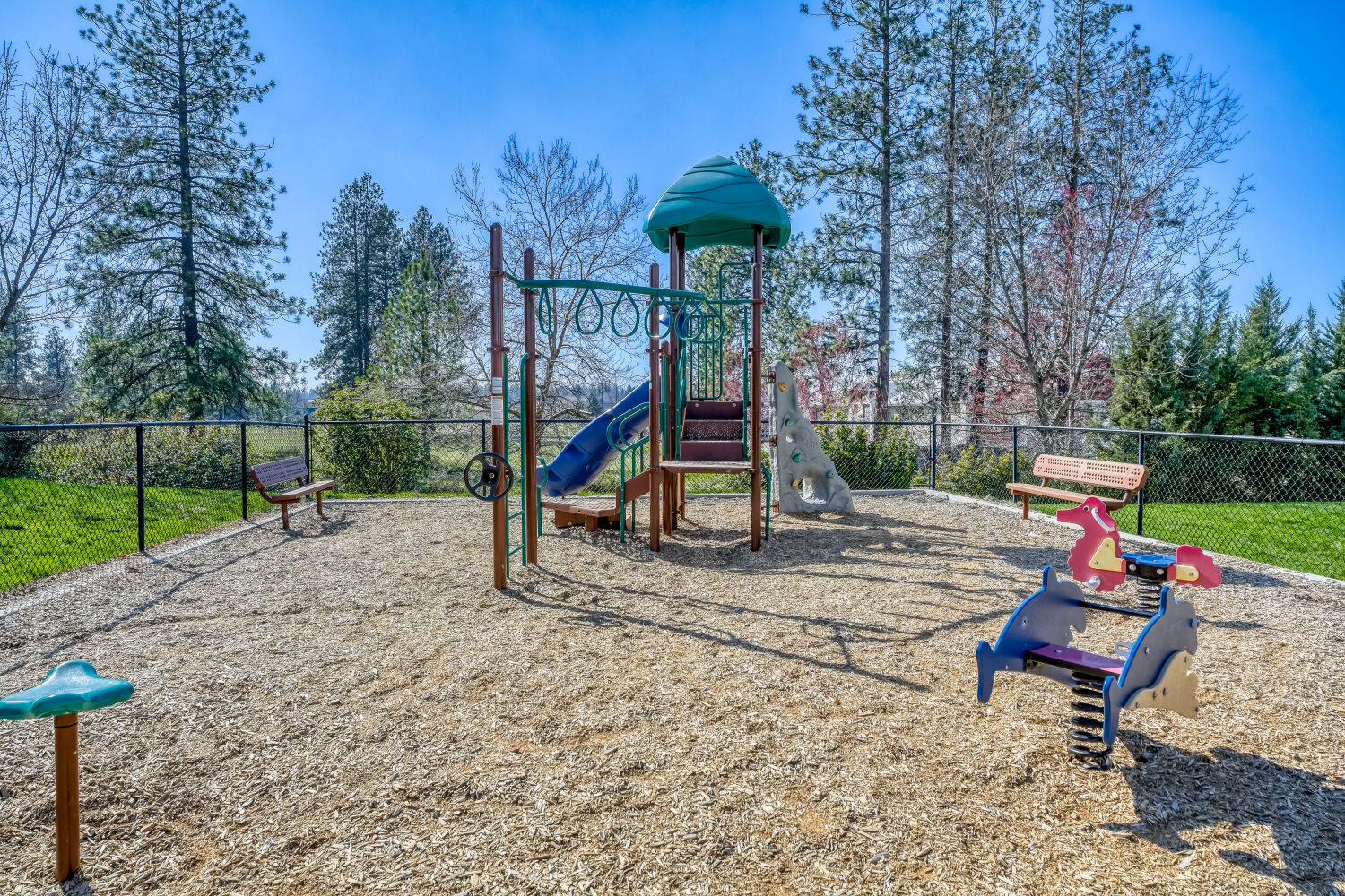 Outdoor playground for children at Copper Hill's pet-friendly affordable apartment community