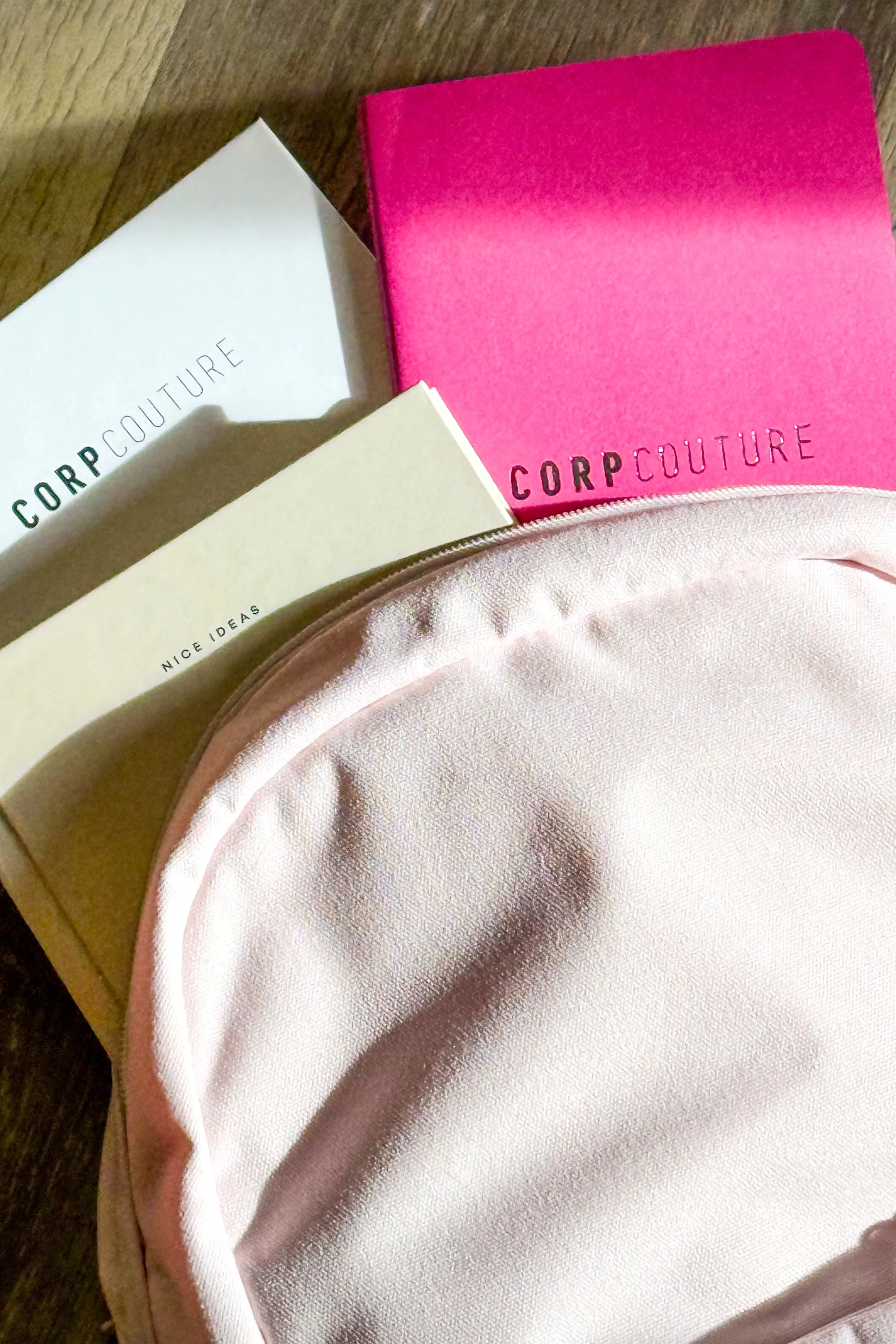 Person holding a teal water bottle decorated with various colorful stickers.