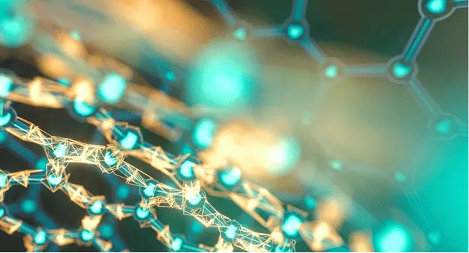 Group of 27 diverse adults posing and smiling for a team photo in a bright industrial-style office.