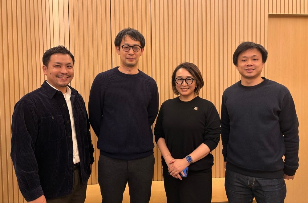 A group photo of the four team members of AQ Partners