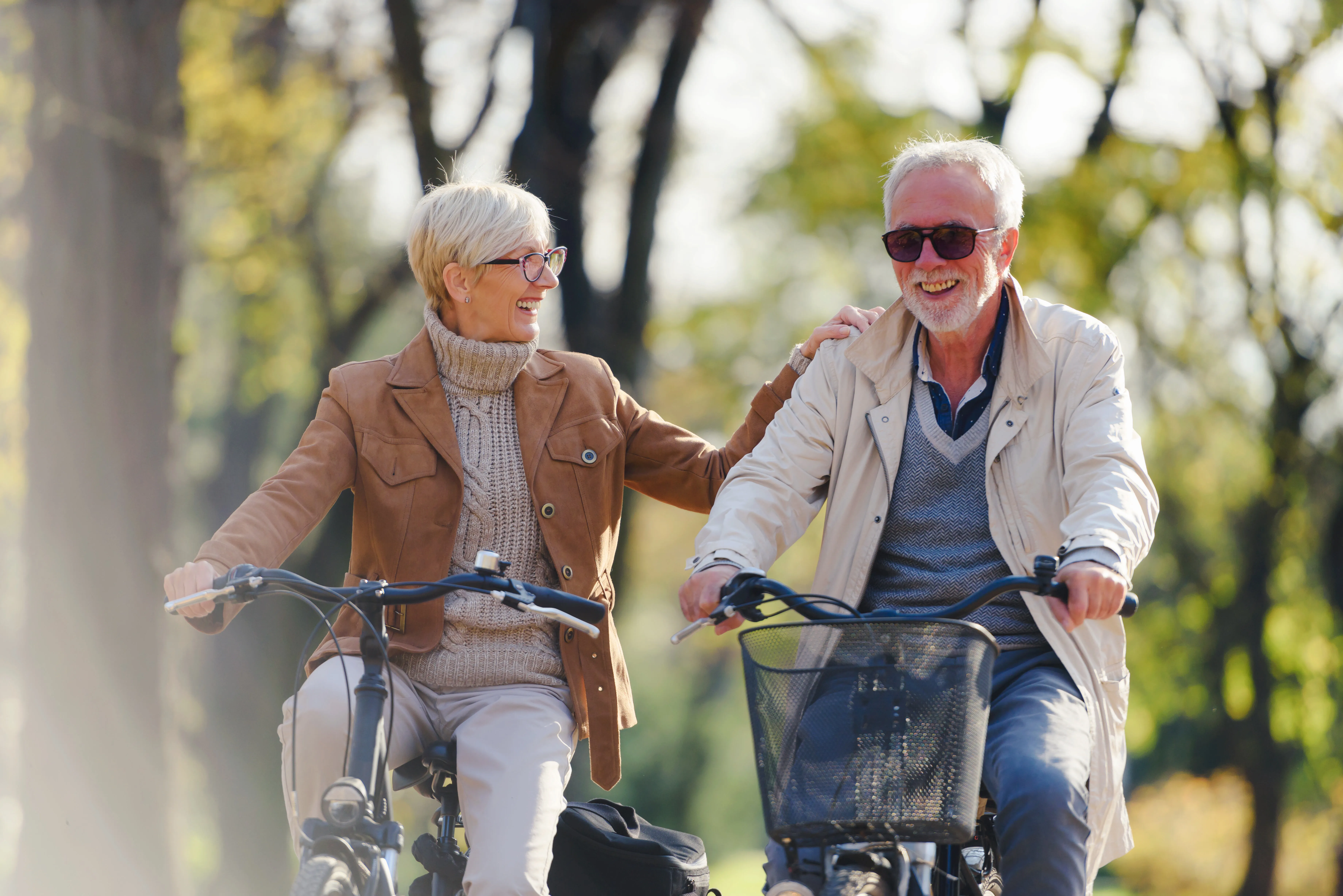 couple riding bikes stock image
