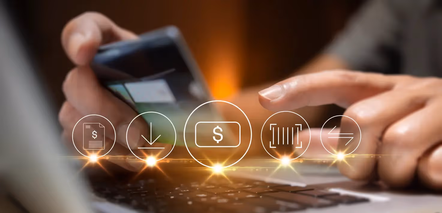 Hands using a smartphone and laptop with glowing digital icons for payments, downloads, and transfers