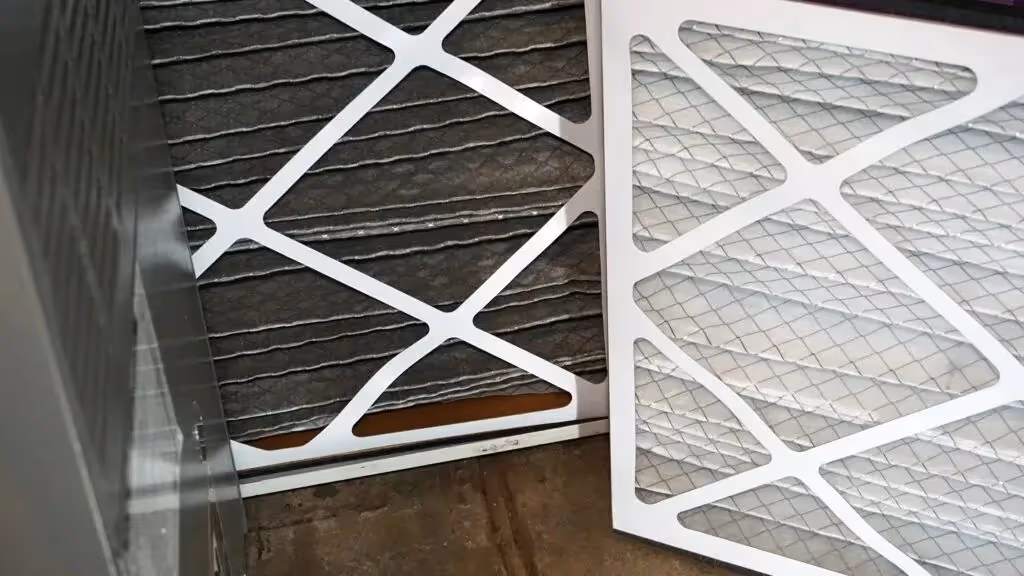 Dirty and clean furnace air filters.