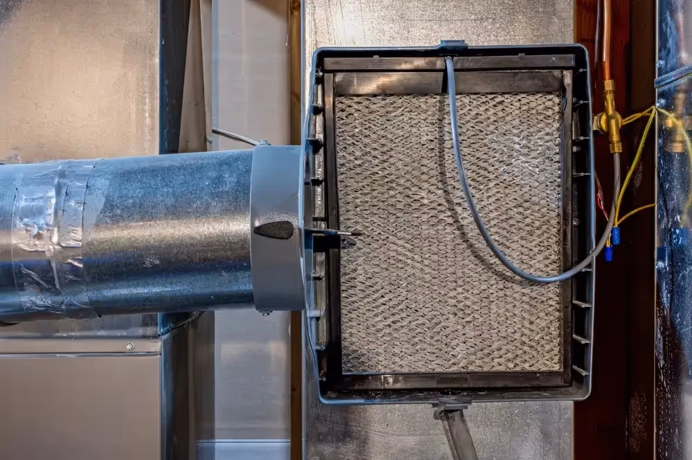 Aprilaire dehumidifier unit on adjustable risers.