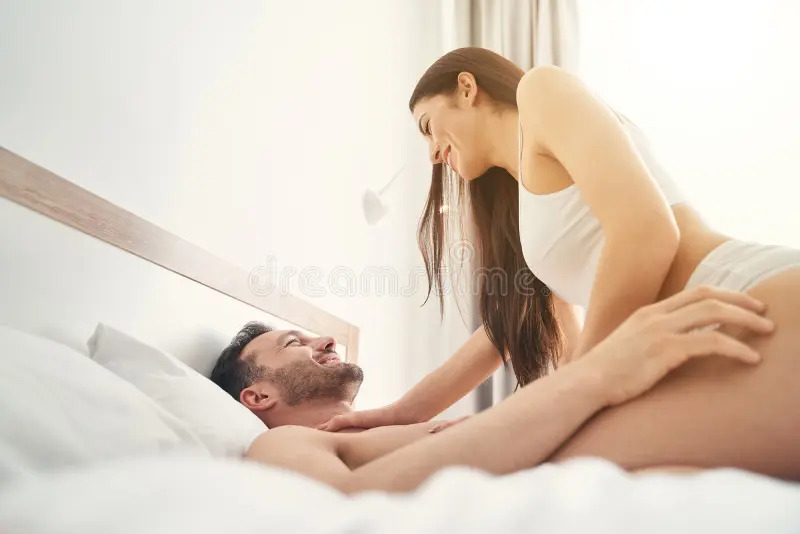 smiling-playful-young-lady-lingerie-sitting-top-her-happy-husband-bed-man-his-wife-playing-bedroom-182831903.jpg