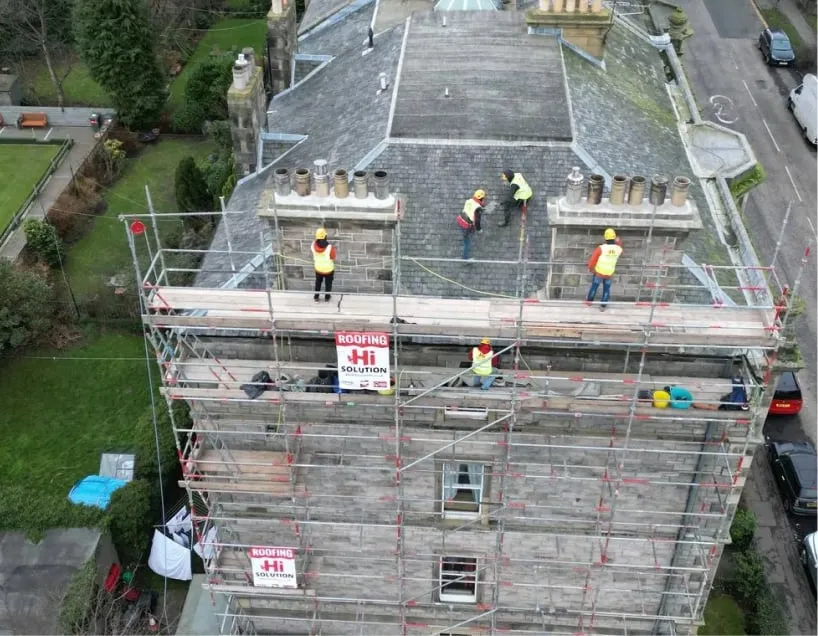 Team of roofers using scaffolding in Edinburgh