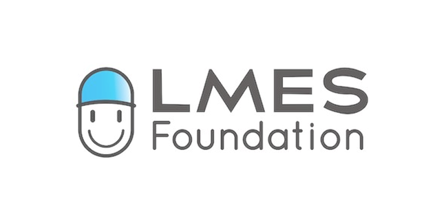 LMES Foundation logo with a smiling face wearing a blue cap.