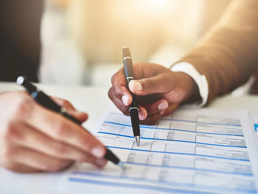 two people doing analysis on a paper