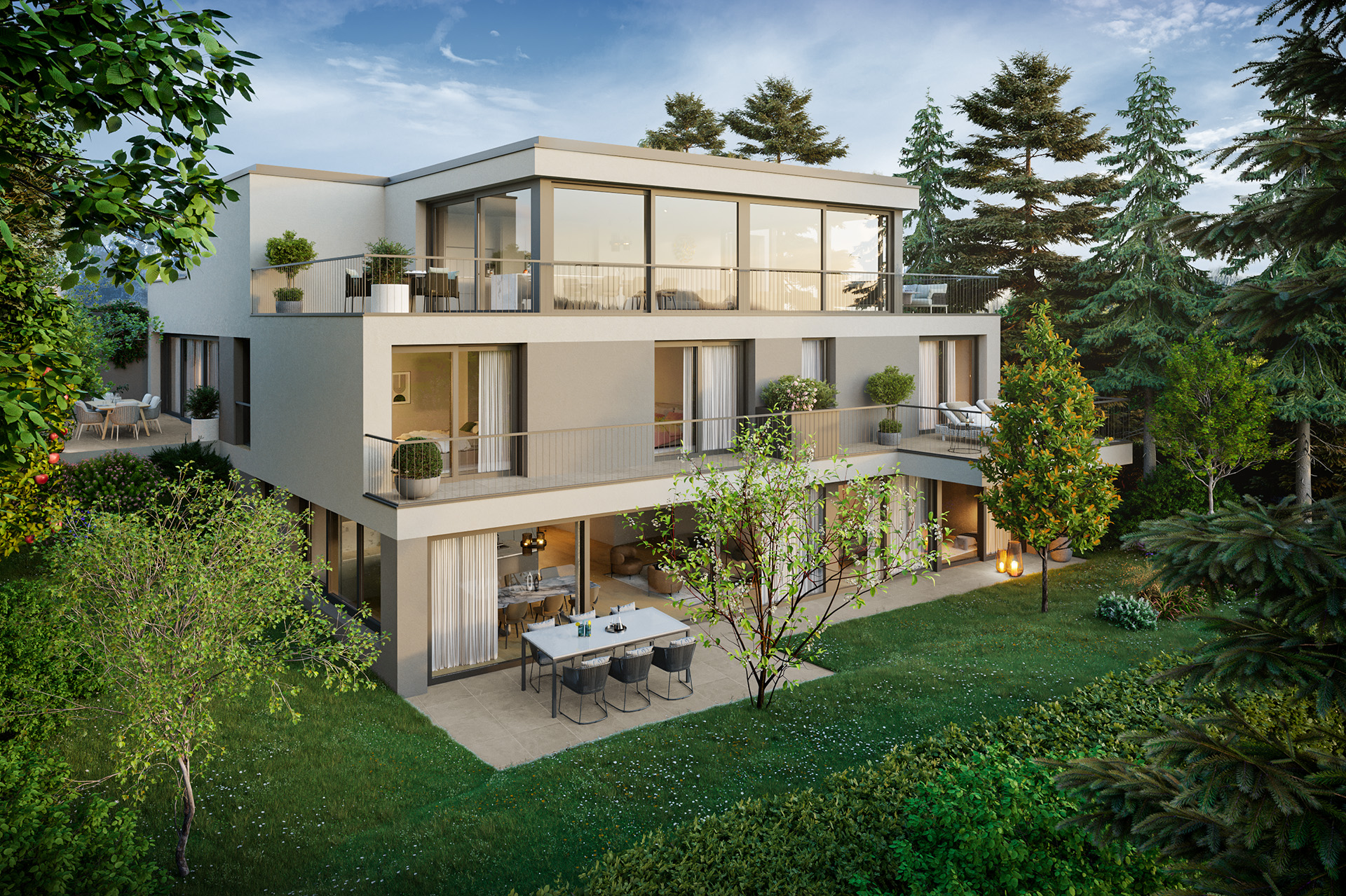 Moderne Wohngebäude mit großen Fenstern und Balkonen in einer grünen Wohngegend bei blauem Himmel.