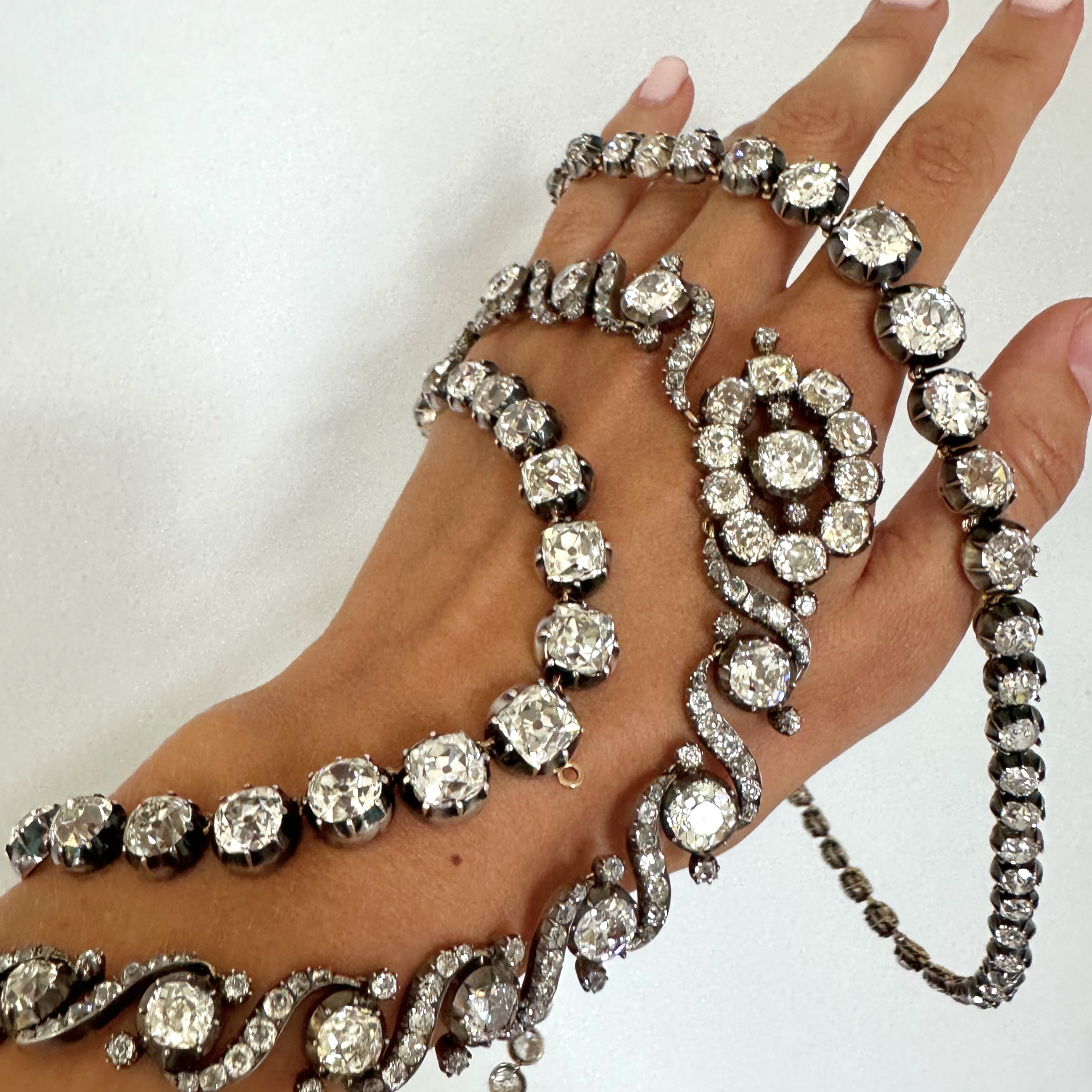 An impressive 41 carat natural Ceylon sapphire, no heat. Suspended from a rare French cut sapphire and rose cut diamond collar necklace. Original 1880.