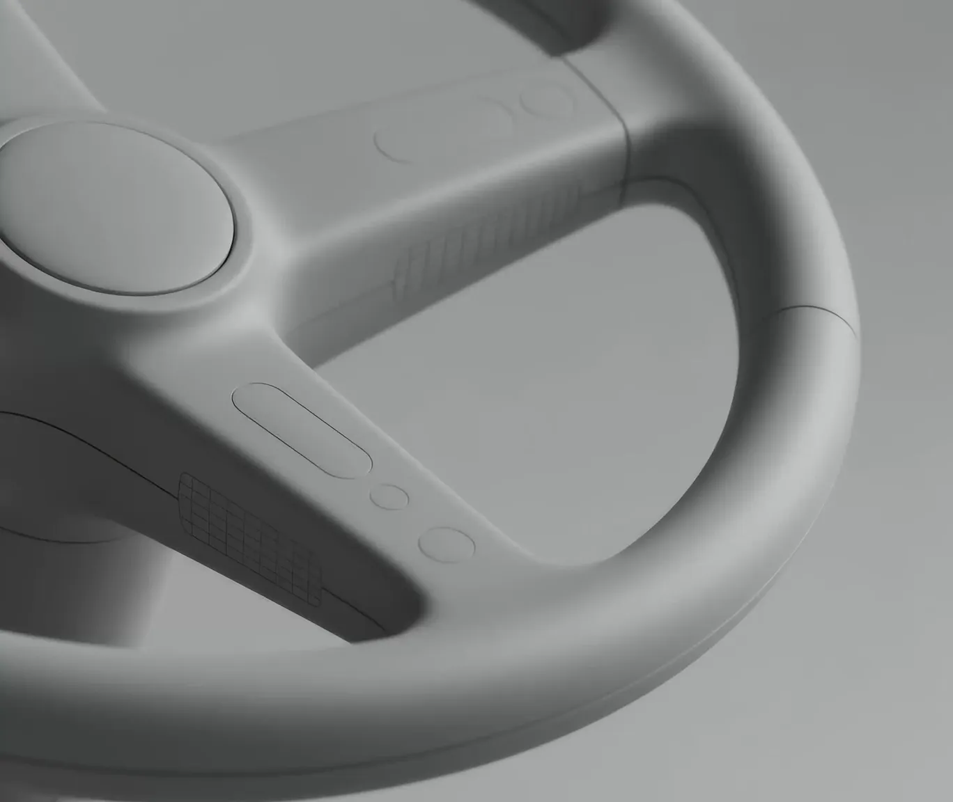 Close-up of a modern, minimalistic car steering wheel in gray with subtle button outlines.