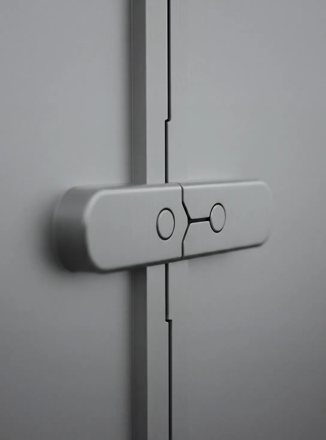 Close-up of a modern, gray, metal hinge on a cabinet or door.