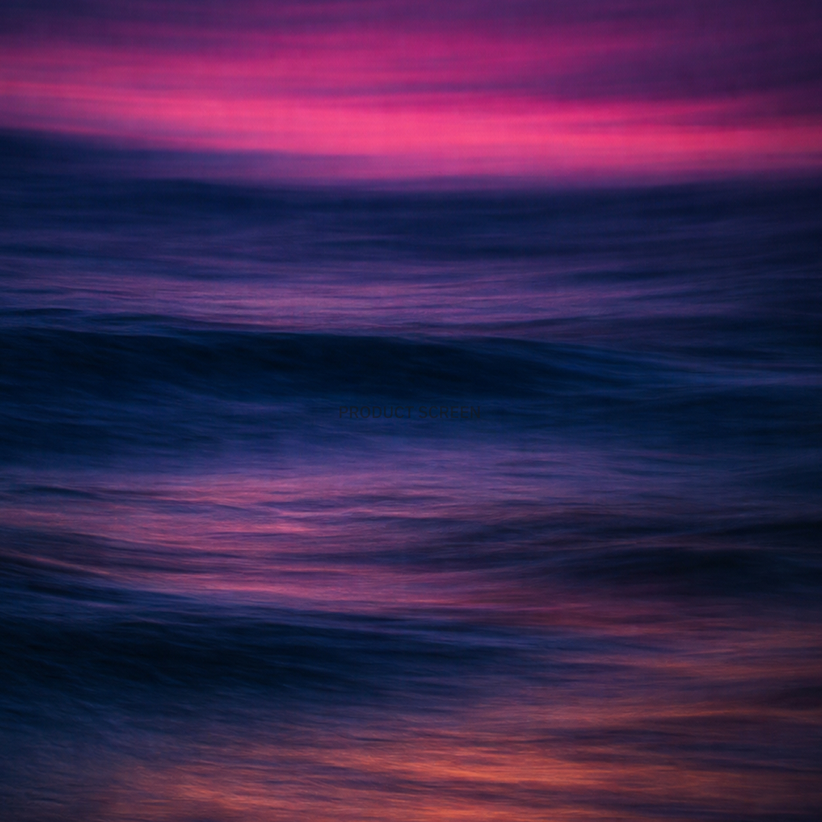 Blurred ocean waves reflecting a vibrant purple and pink sunset.