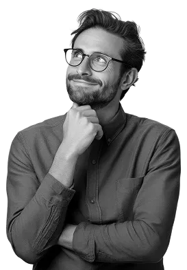 Thoughtful man with glasses and beard resting his chin on his hand while looking upwards.