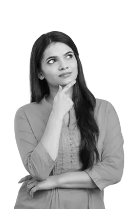 Thoughtful woman with long dark hair, wearing a light-colored blouse, resting her chin on her hand and looking upward.
