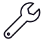 Icône d'une clé anglaise noire.