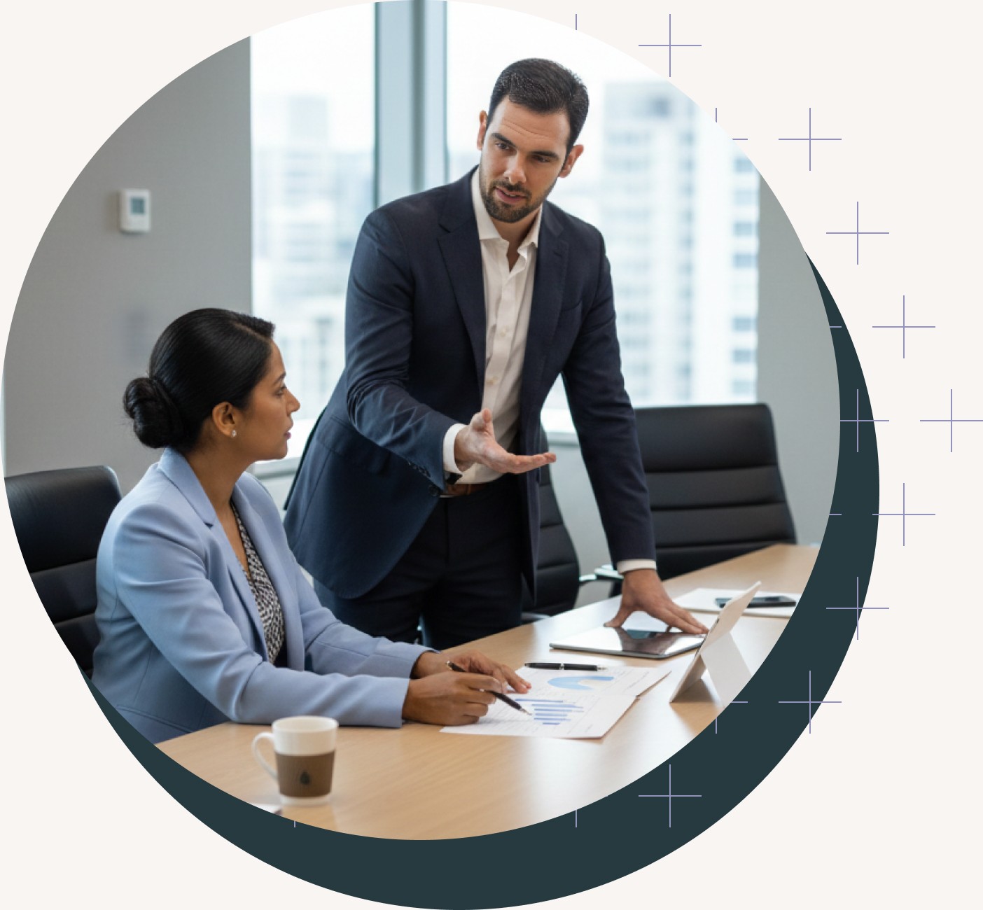Two people discussing finances in a meeting room