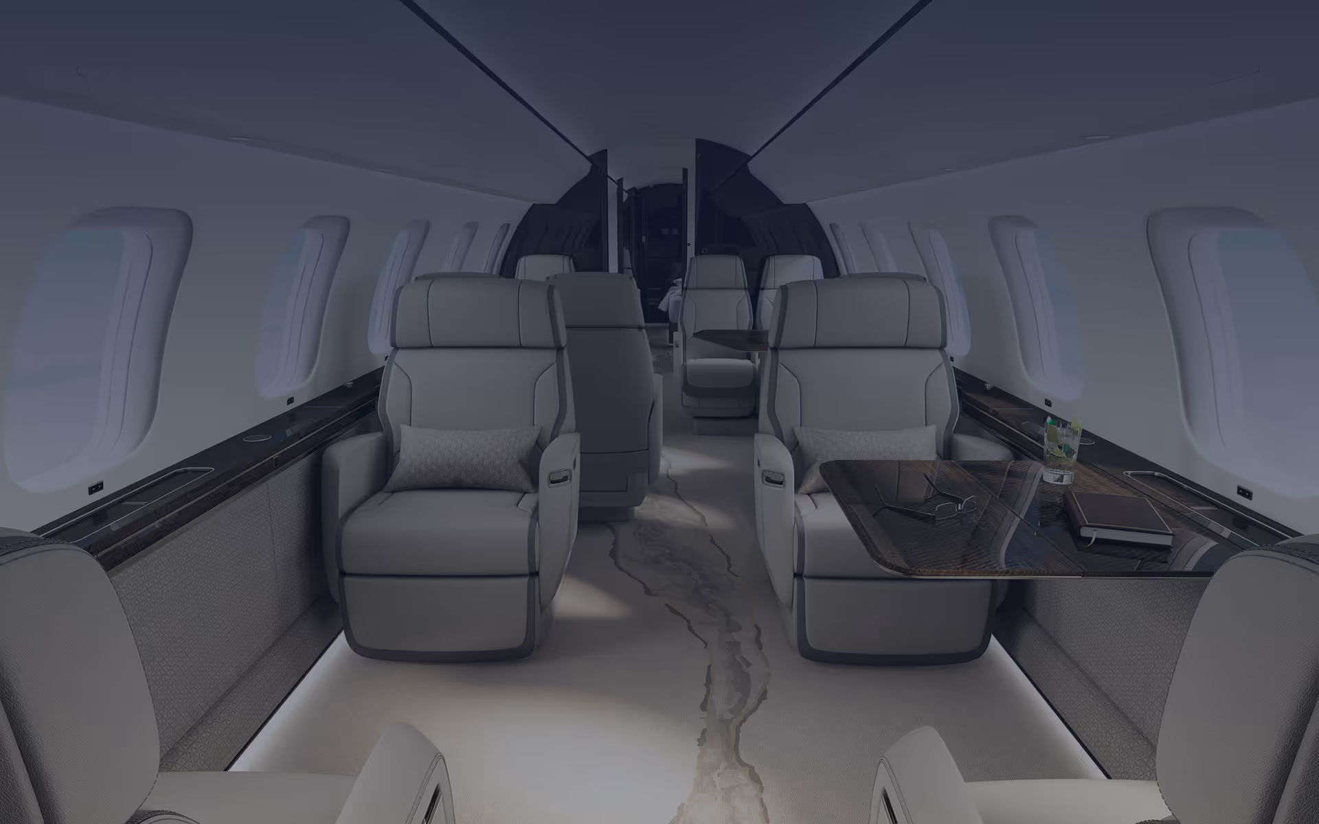 Luxurious private jet interior with beige leather seats, marble floor, and a glass-top table holding a book and drink.