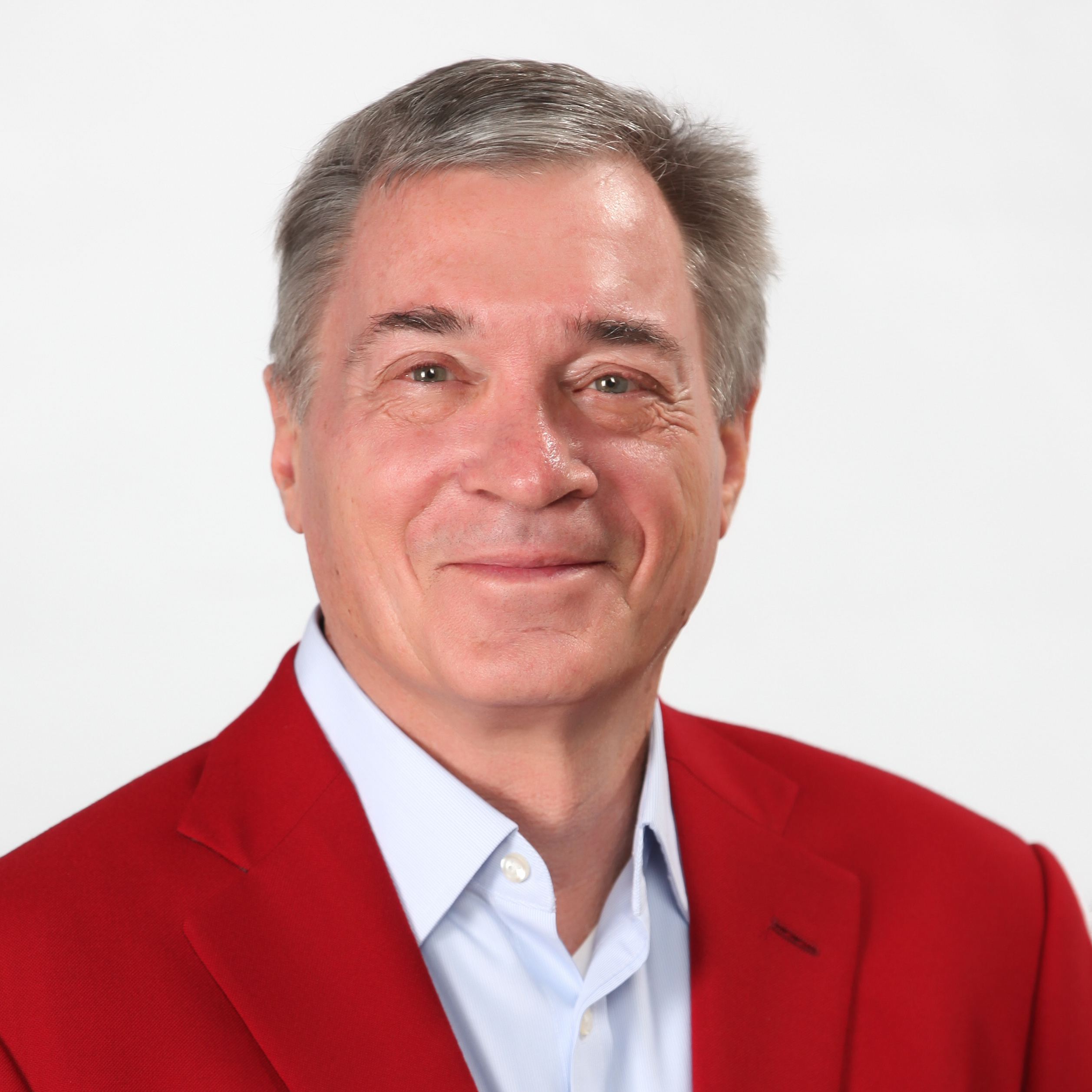 Smiling business man in a red suit jacket and white collared shirt
