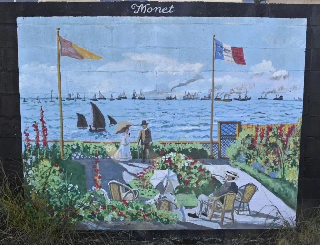 Mural of a bright sun radiating over a field with a solitary figure in a hat holding a stick. Vibrant colors create a warm, hopeful tone.