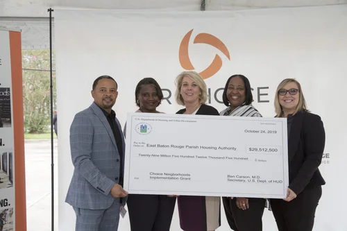 Group of five poses with the $29.5M HUD Choice Neighborhoods grant check.
