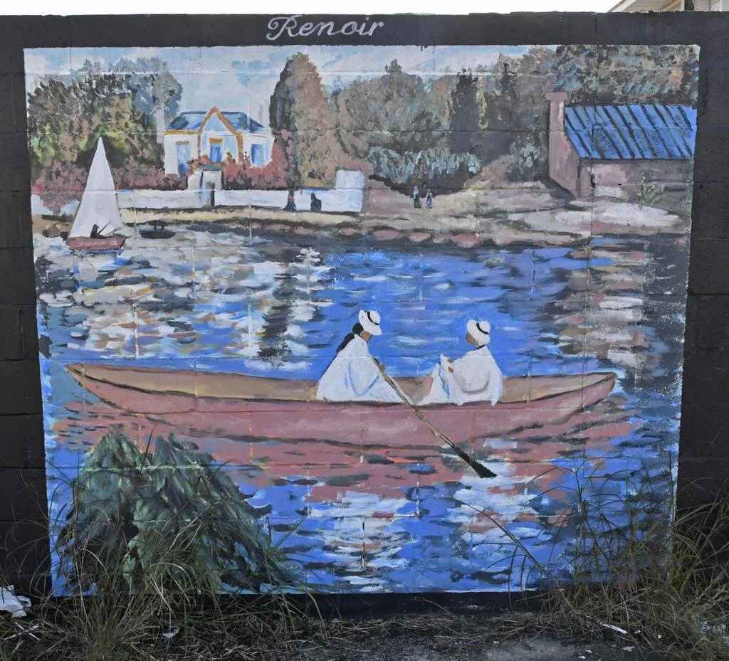 A mural inspired by Renoir depicts two people rowing a pink boat on a blue, reflective river. A white sailboat and houses are visible in the background.
