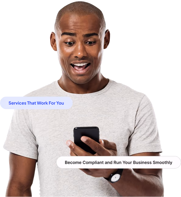Man in gray shirt looking surprised at his smartphone screen with text overlays about services and compliance.