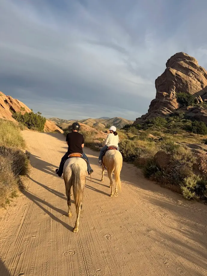 Beginners on a scenic trail having their first horseback riding experience