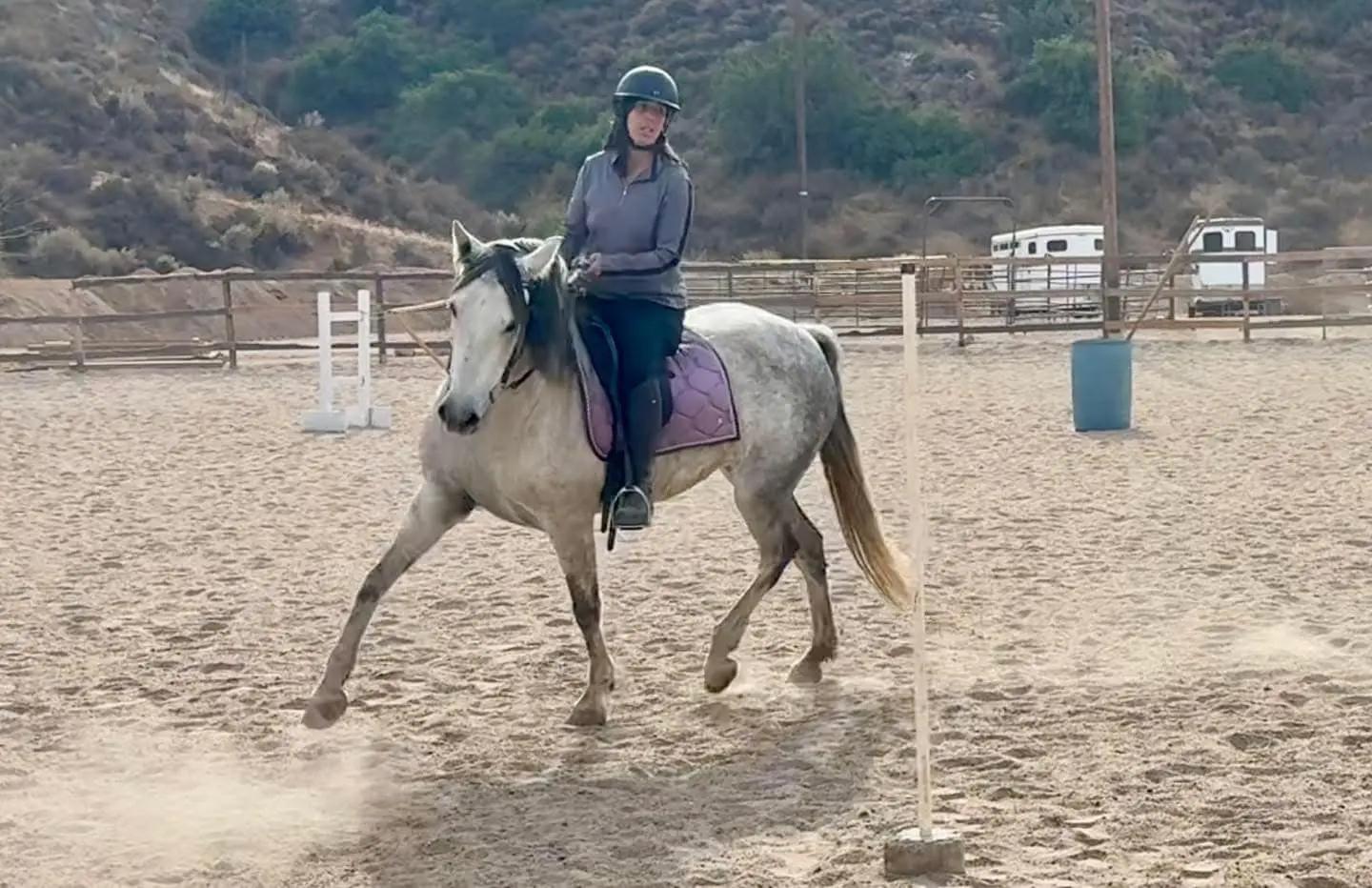 Smiling rider in western horseback riding lesson near me