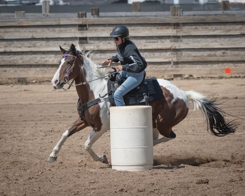 Rider demonstrating advanced barrel racing technique