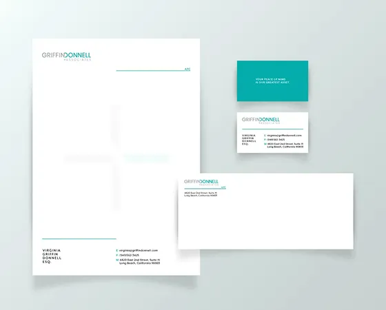 Stationery and business cards in a white and teal palette for Griffin Donnell, created by a top creative marketing agency.