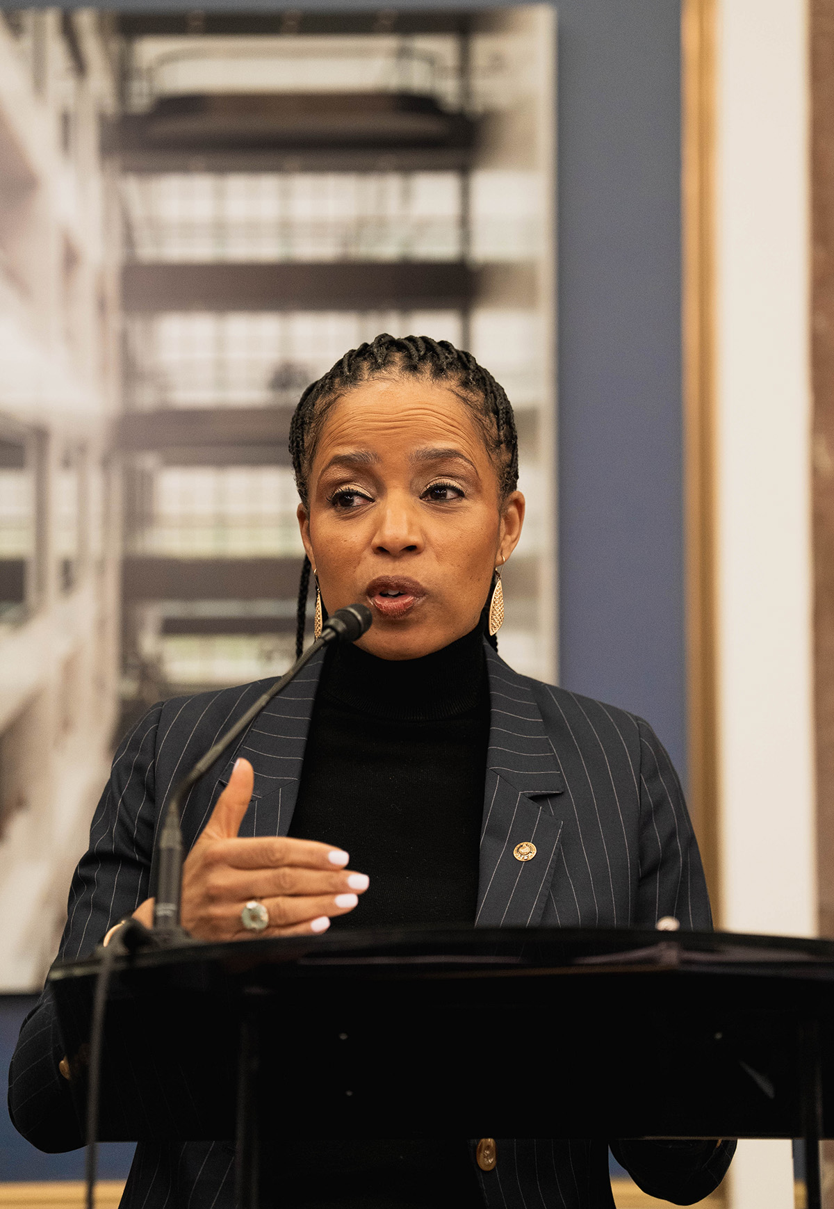 Nichelle Gainey speaking passionately at the Senate event