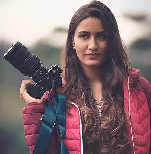 Vintage world map with multiple travel photos clipped and pinned across various continents.