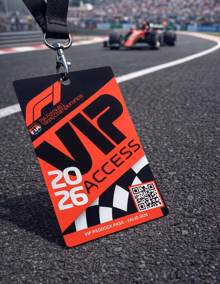 2026 FIA Formula 1 World Championships VIP Access paddock pass with a race car and crowd blurred in the background on the track.