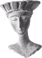 Gray stone sculpture of a woman’s head with closed eyes and a wide crown.