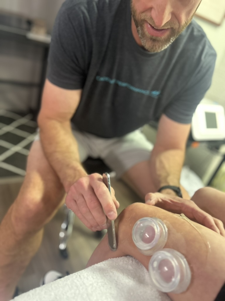 Patient working with a provider at a physical therapy clinic in Flagstaff, AZ during a manual therapy session for knee pain