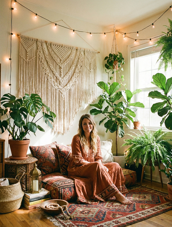 Eclectic space with patterned rugs, hanging macrame, and relaxed floor seating.