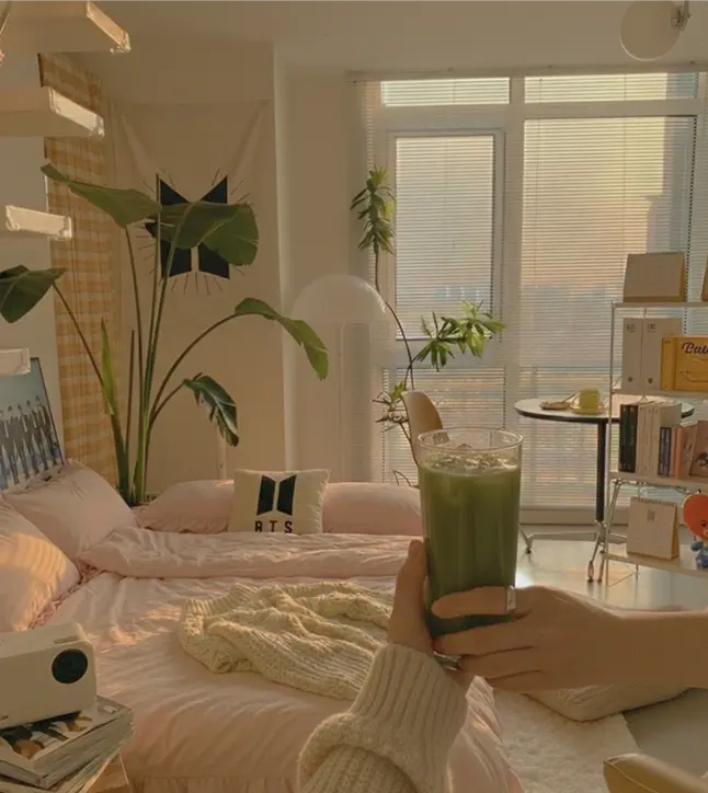 Cozy Korean style bedroom with floor cushions and a home cinema projector setup.