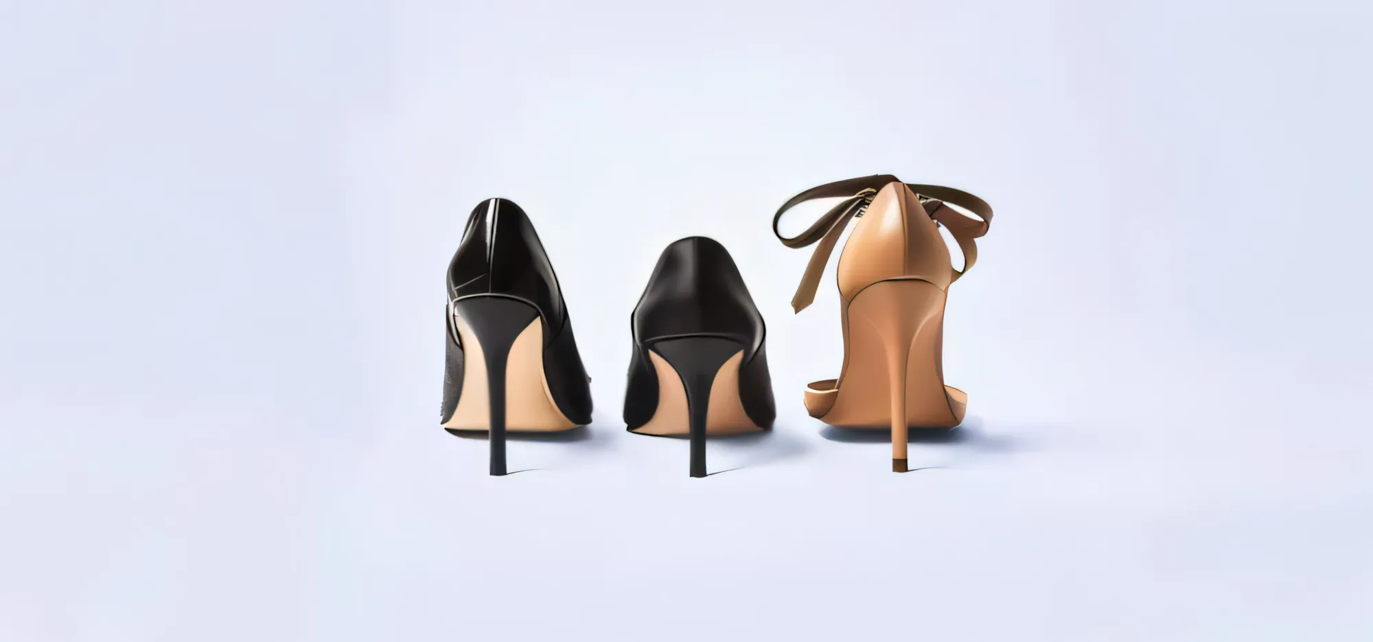 Three high heels are standing next to each other.