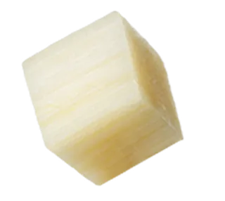 Single cube of diced light yellow cheese with smooth surface.