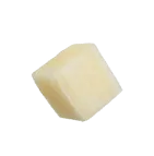 Single small cube of diced white cheese on a plain background.
