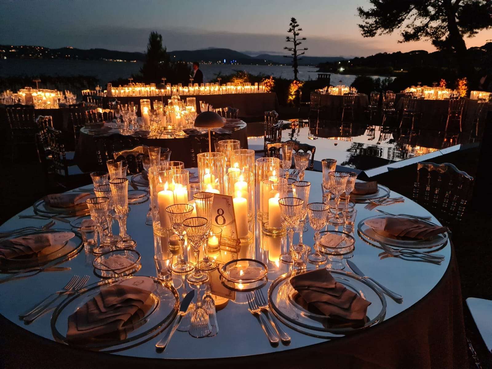 Candlelit dinner table by the sea