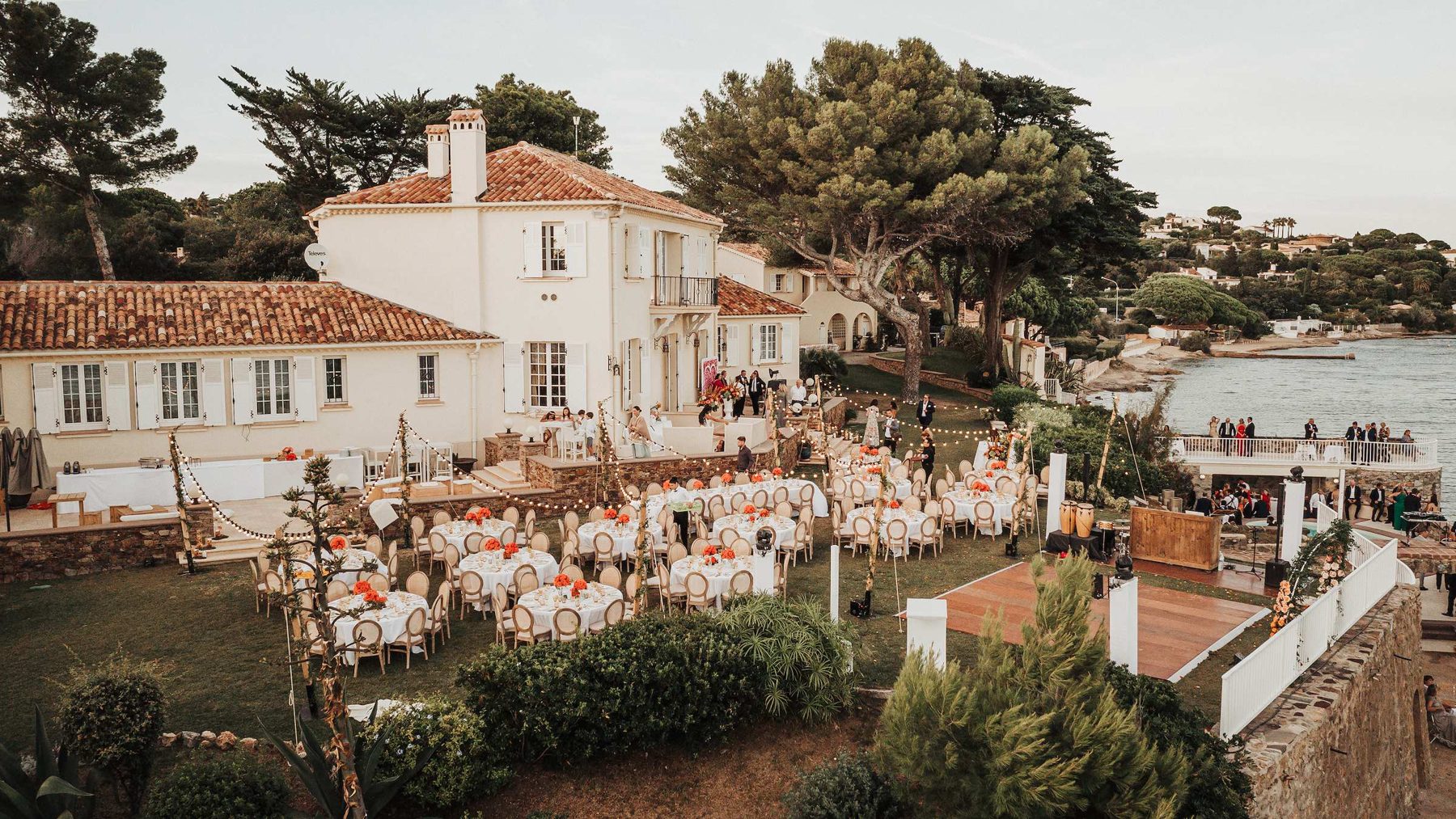 Reception on the lawn of a seaside estate