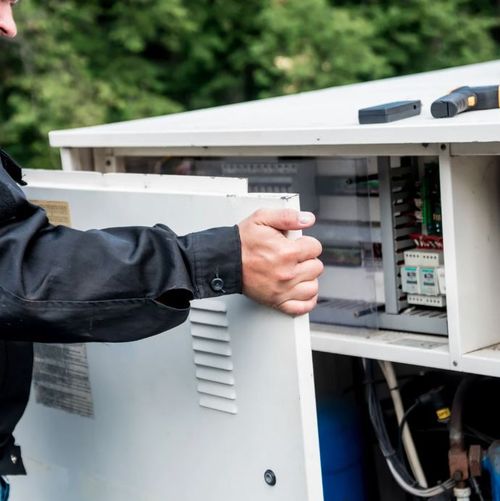 HVAC Services in Columbus OH - Technician working on electrical components of HVAC system