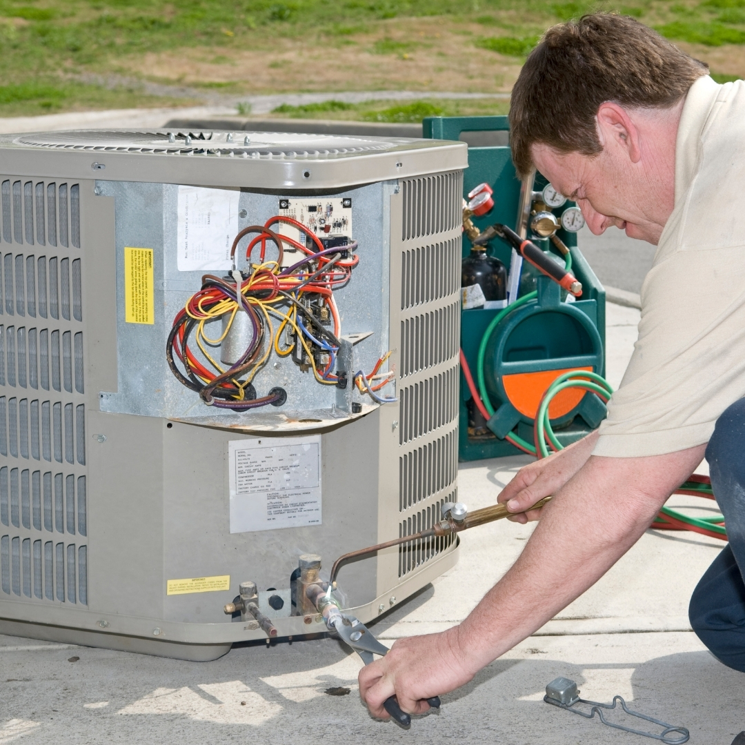 HVAC Services in Columbus OH - Technician working on electrical components of HVAC system