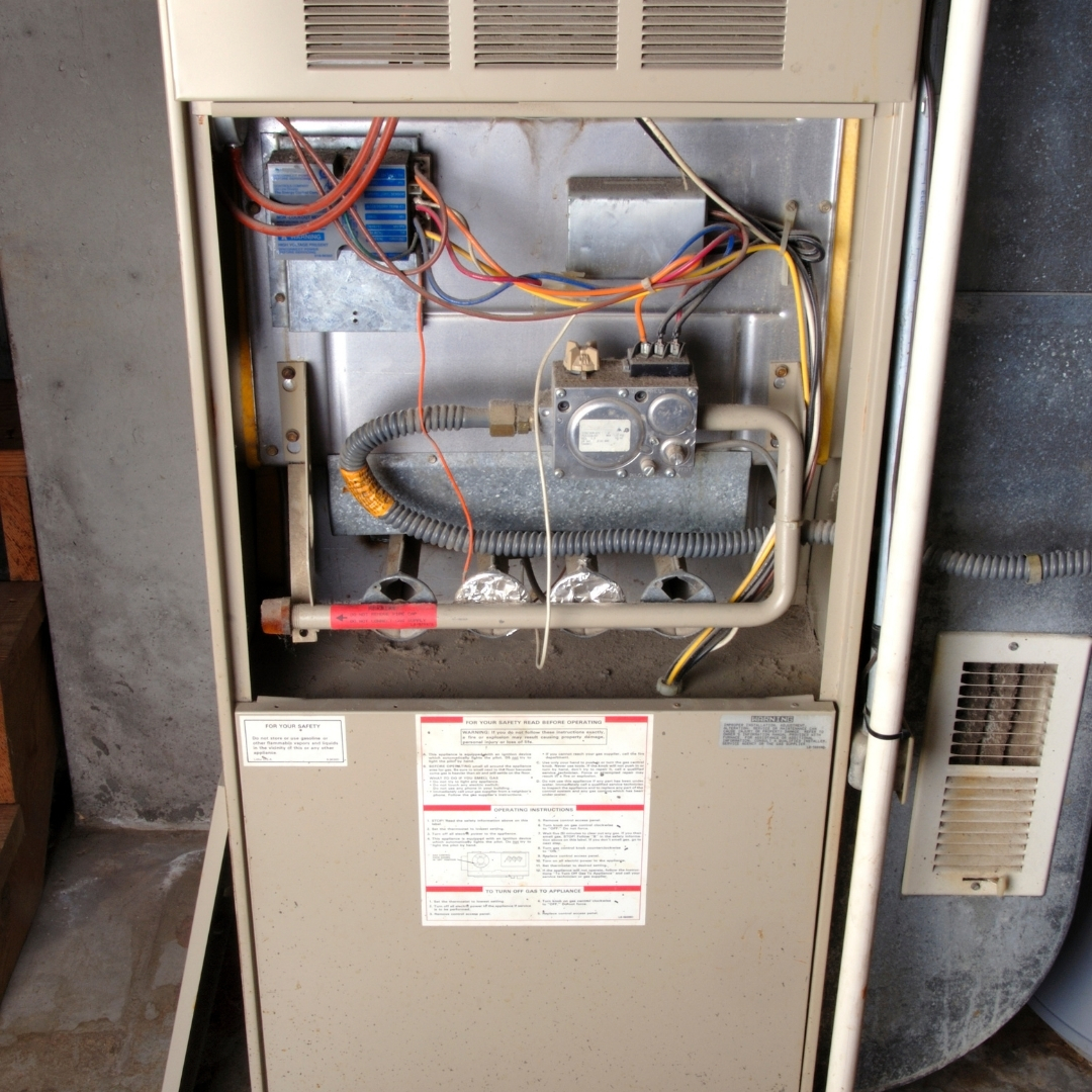 HVAC Services in Columbus OH - Technician working on electrical components of HVAC system