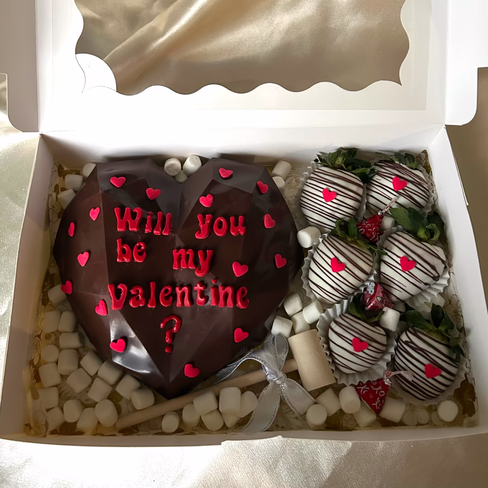 The Sweetheart Statement, chocolate breakable heart paired with chocolate covered strawberries by Ashley's Anotijitos Grand Rapids