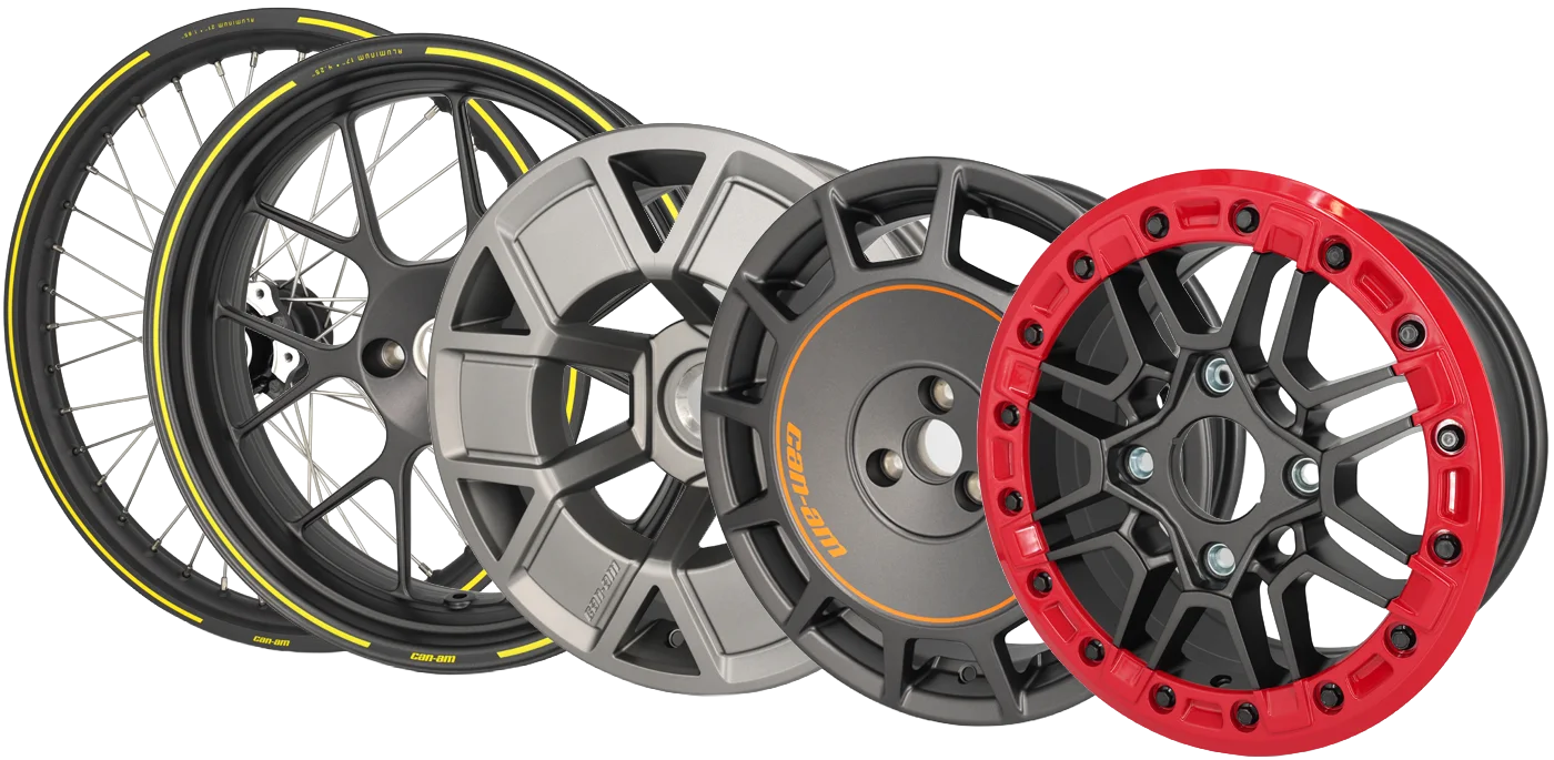 Two car wheels with intricate spoke designs