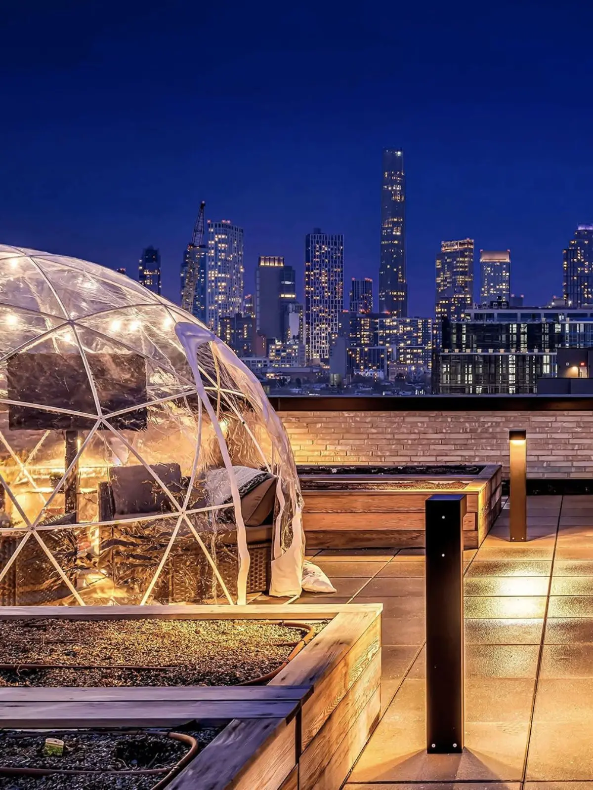 Heated rooftop igloo rental in Brooklyn with skyline view for private events and corporate gatherings
